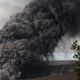 An ash plume rising from the Overlook crater.